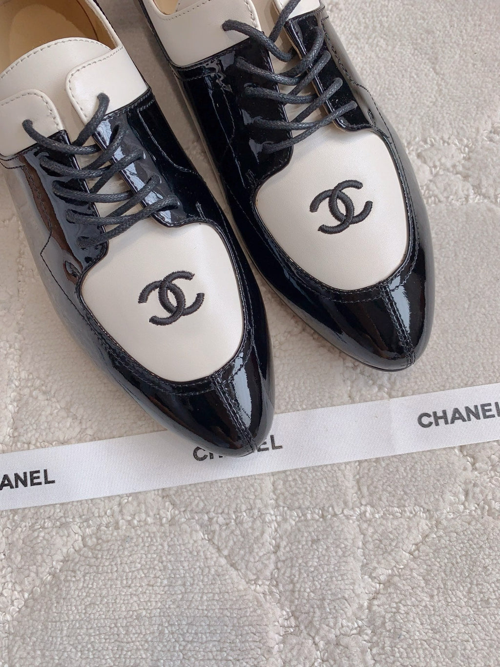 CHANEL 25S TWO TONE LACE UP IN BLACK AND WHITE SHINY CALFSKIN